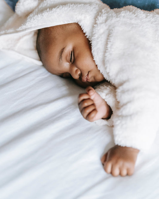 Newborn in cot bed