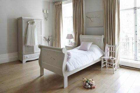 Single kids sleigh bed with Linen Blossom paintings | Dragons of Walton Street